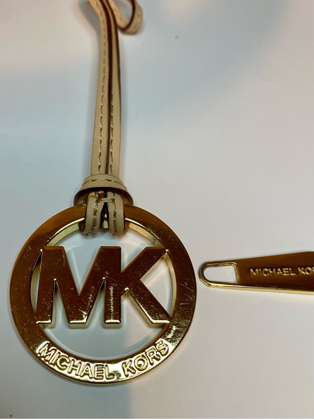 Michael Kors Bag Charm Fob and Zipper Pull MK Logo Gold Tone Tan Leather Strap